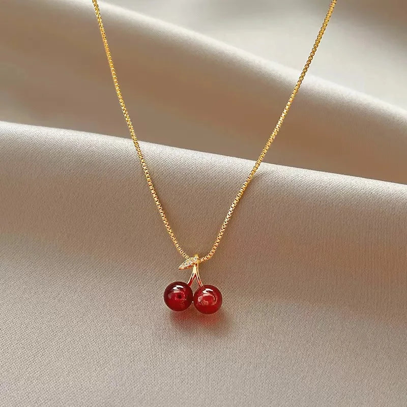 The 2025 summer classic sweet wine red cherry pendant necklace is a fashionable and individual fruit golden chain necklace for w